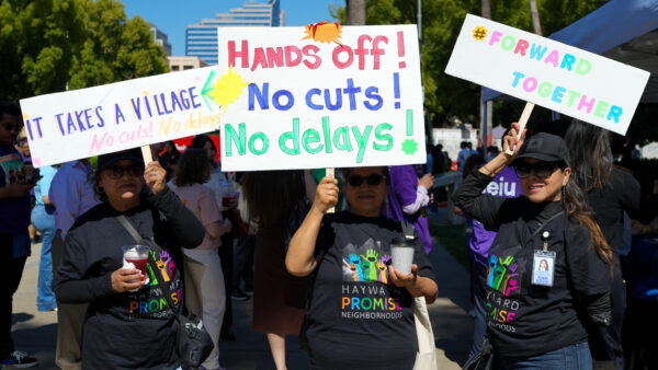 Women at a child care rally at California's capitol, advocating for more support for the child care system.
