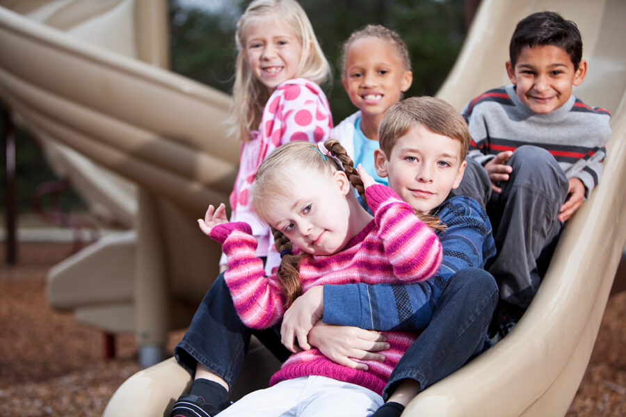 Young kids playing with a child with special needs