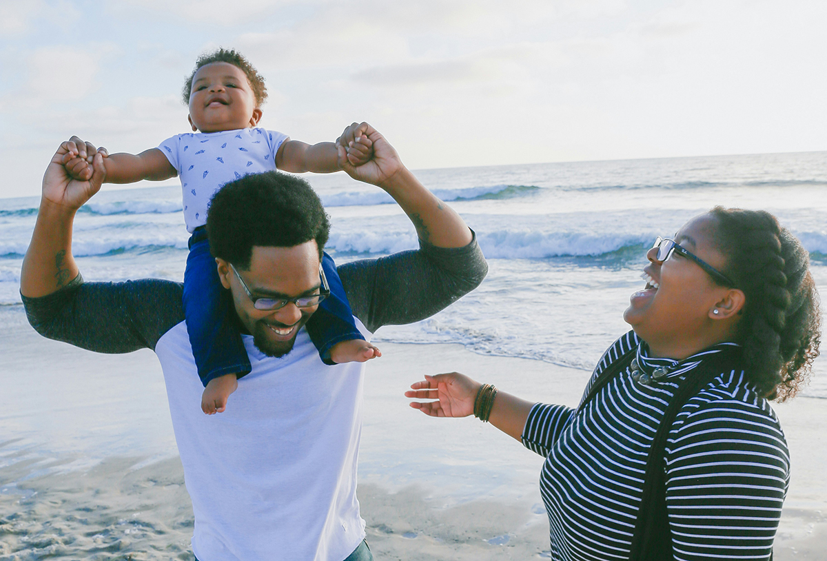 Parent smiling with a young child
